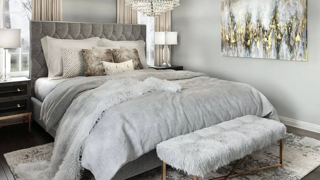 Ein lässig-luxuriöses Schlafzimmer in Grautönen mit kuschligen Textilien